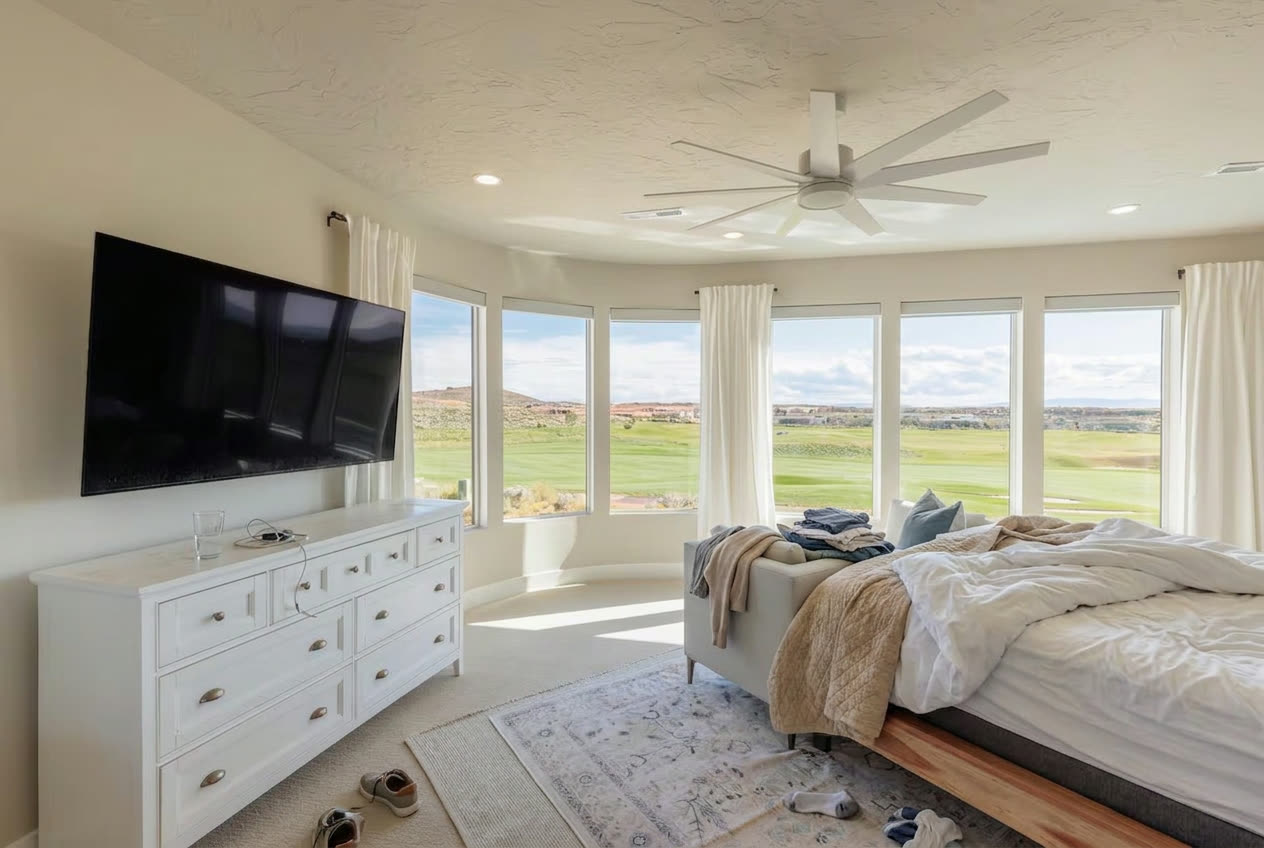Lived-in primary bedroom before a TrueCove cleaning in St. George, Utah